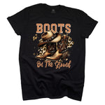 Black t-shirt with cowboy boots and hat graphic and 'Boots on the Ground' text