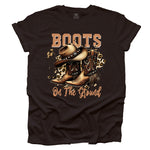 Brown t-shirt with cowboy boots and hat graphic and 'Boots on the Ground' text