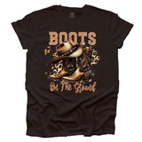 Brown t-shirt with cowboy boots and hat graphic and 'Boots on the Ground' text
