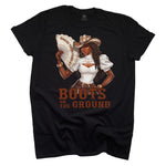 Black t-shirt with a graphic of a woman in a cowboy hat holding a fan, with text 'WHERE THEM FANS AT' and 'BOOTS ON THE GROUND'.